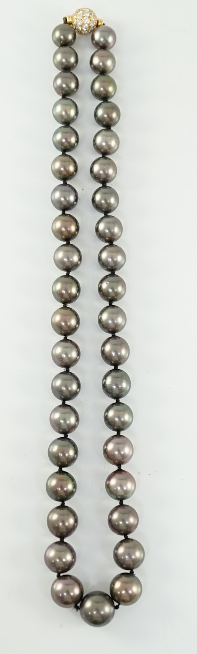 A modern Cartier single strand Tahitian pearl necklace, with 18ct gold and pave set diamond spherical clasp